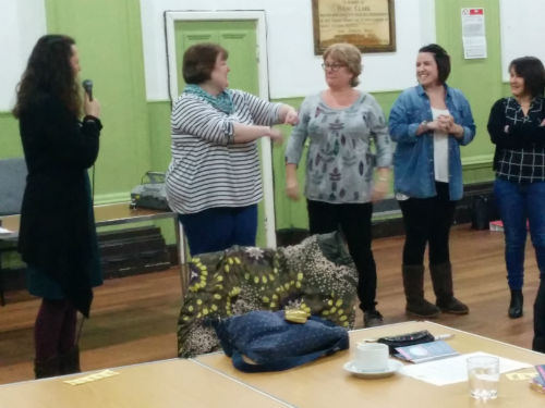 Members practising laughter yoga